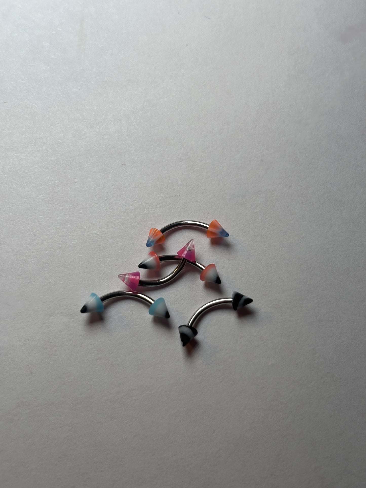 Curved marble pointed edge piercing