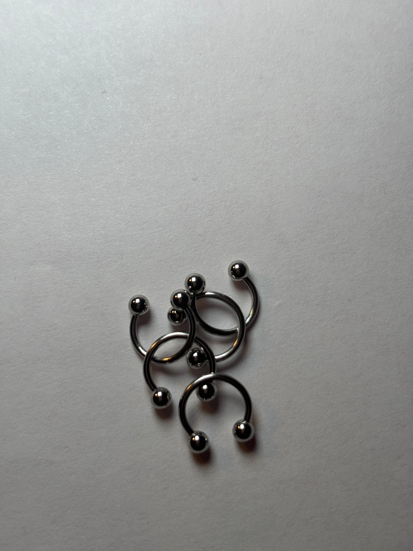 Small stainless steel, horseshoe piercing
