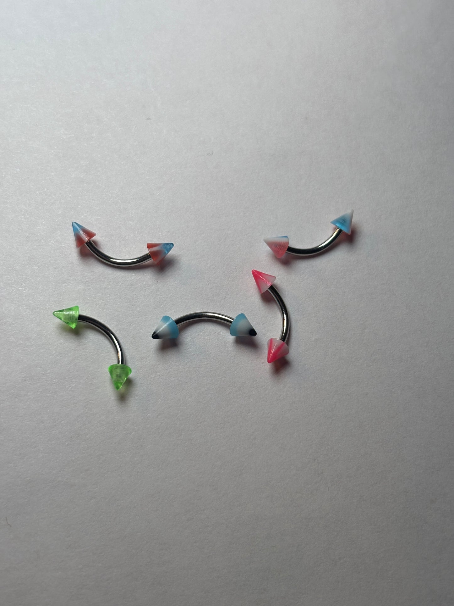 Curved marble pointed edge piercing