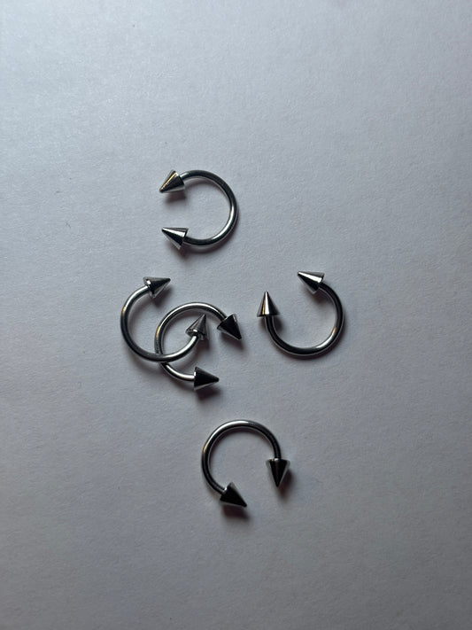 Small stainless steel, horseshoe piercing pointed edge